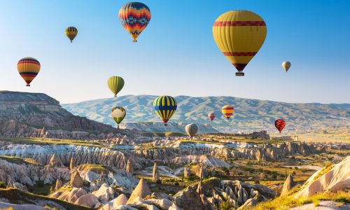 Hot air balloons flying in sunset sky Cappadocia, Turkey